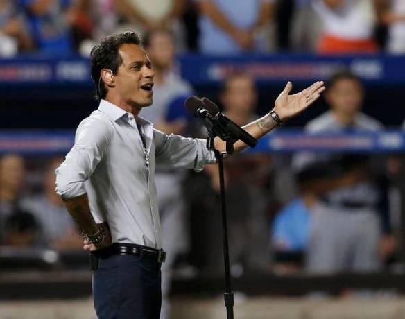 Marc Anthony sings God Bless America during the seventh inning stretch at Major League Baseball's All-Star Game in New York